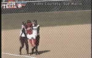 Softball player carried around bases by opponents