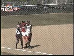 Softball player carried around bases by opponents